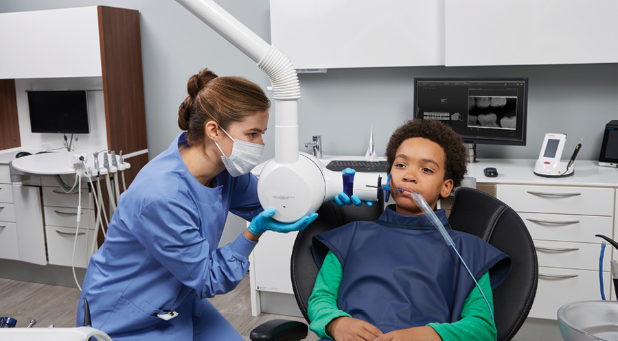 The xray is positioned for a pediatric patient. Courtesy of Dentsply Sirona.